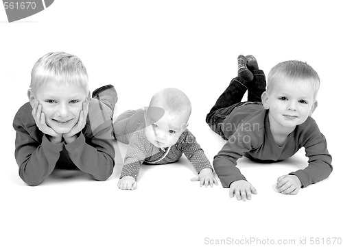 Image of Three children lying on the floor