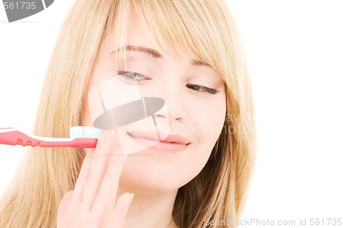 Image of happy girl with toothbrush