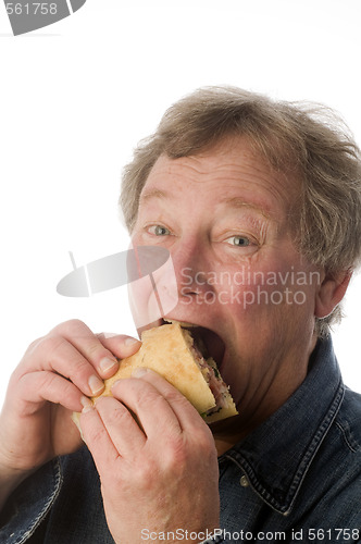 Image of man eating large sandwich