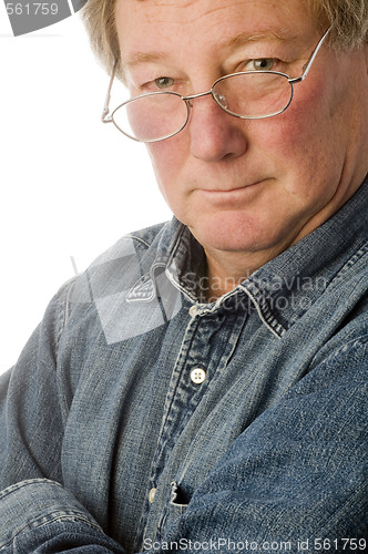 Image of smiling relaxed confident middle age senior man with eyeglasses 
