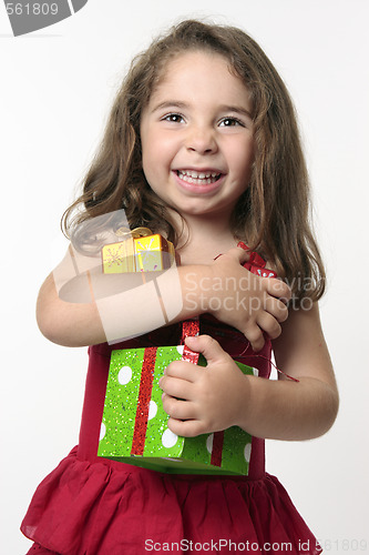 Image of Jovial happy girl child holding presents