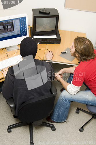 Image of students editing video on computer