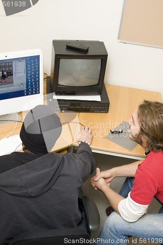 Image of students editing video on computer
