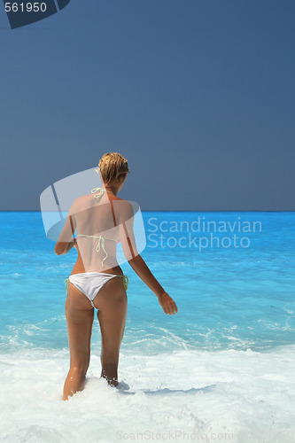 Image of Pretty blonde woman enjoying the Ionian sea in Greece