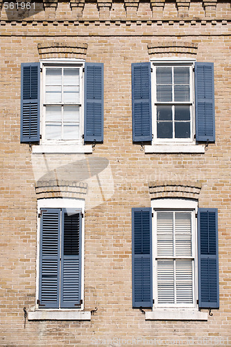 Image of Windows with blue shutters