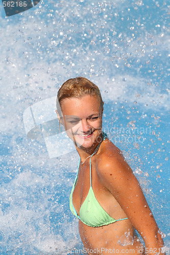 Image of Young beautiful happy smiling tanned blond woman in bikini