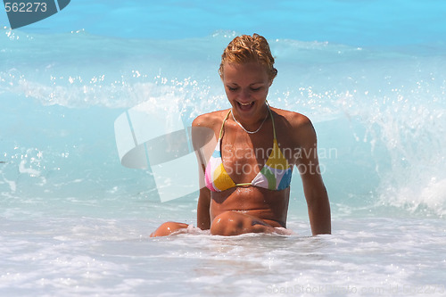 Image of Pretty blonde woman enjoying the Ionian sea in Greece