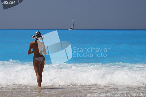 Image of Pretty blonde woman enjoying the Ionian sea in Greece