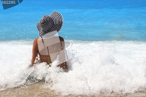 Image of Pretty blonde woman enjoying the Ionian sea in Greece