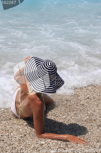 Image of Pretty blonde woman enjoying the Ionian sea in Greece