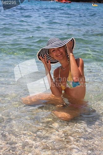 Image of Pretty blonde woman enjoying the Ionian sea in Greece