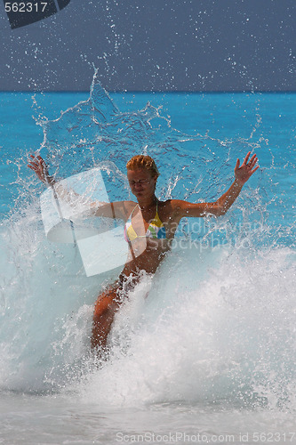 Image of Pretty blonde woman enjoying the Ionian sea in Greece