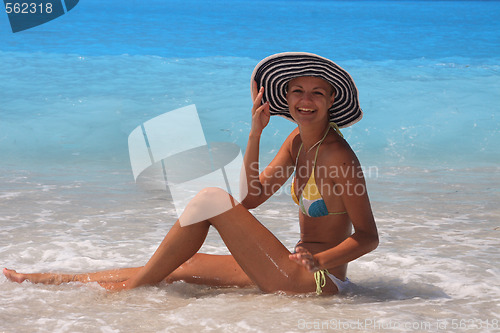 Image of Pretty blonde woman enjoying the Ionian sea in Greece