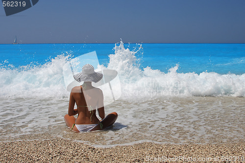 Image of Pretty blonde woman enjoying the Ionian sea in Greece