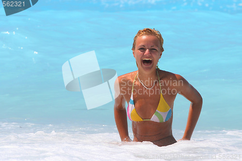 Image of Pretty blonde woman enjoying the Ionian sea in Greece