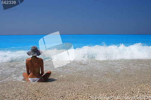 Image of Pretty blonde woman enjoying the Ionian sea in Greece