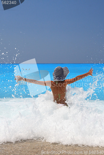 Image of Pretty blonde woman enjoying the Ionian sea in Greece