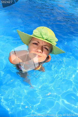 Image of Young woman in a swimming pool