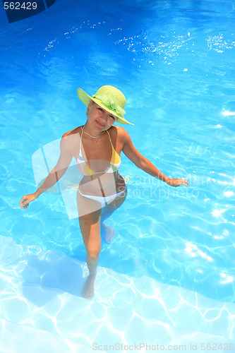 Image of Young woman in a swimming pool