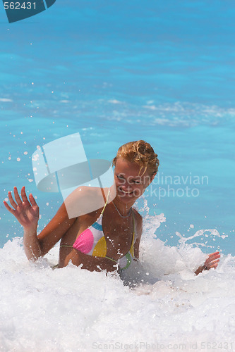 Image of Pretty blonde woman enjoying the Ionian sea in Greece