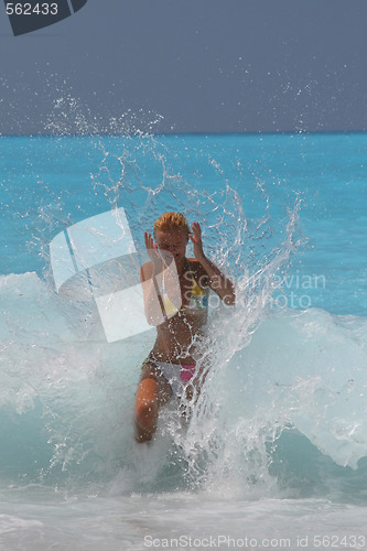 Image of Pretty blonde woman enjoying the Ionian sea in Greece