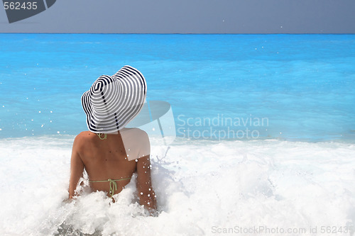 Image of Pretty blonde woman enjoying the Ionian sea in Greece