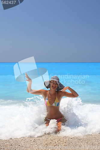 Image of Pretty blonde woman enjoying the Ionian sea in Greece