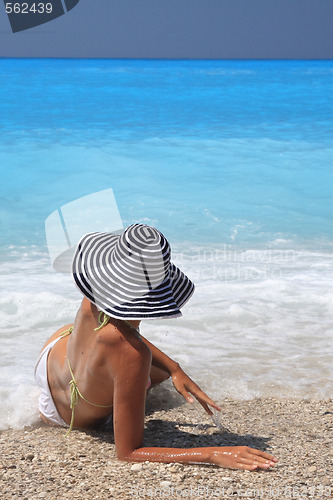 Image of Pretty blonde woman enjoying the Ionian sea in Greece