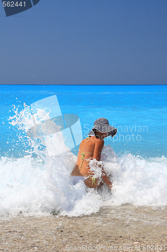 Image of Pretty blonde woman enjoying the Ionian sea in Greece