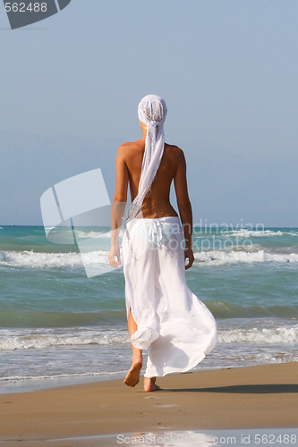 Image of Beautiful young woman relaxing near the sea