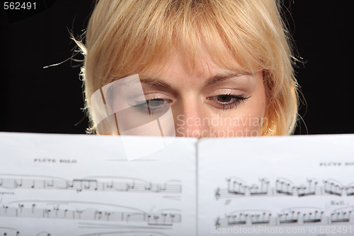 Image of Woman reading a music score