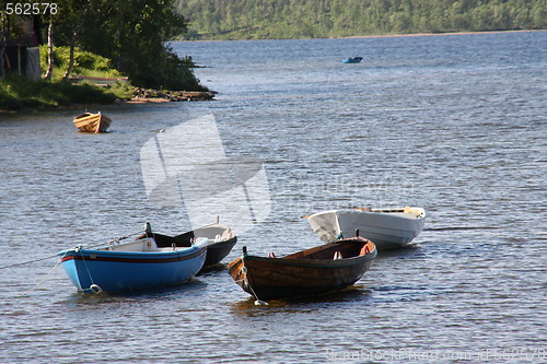 Image of four row boats