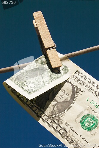 Image of dollar bill folded on the line