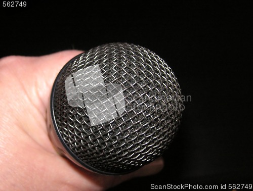 Image of microphone in hand