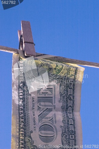 Image of dollar bill on the line