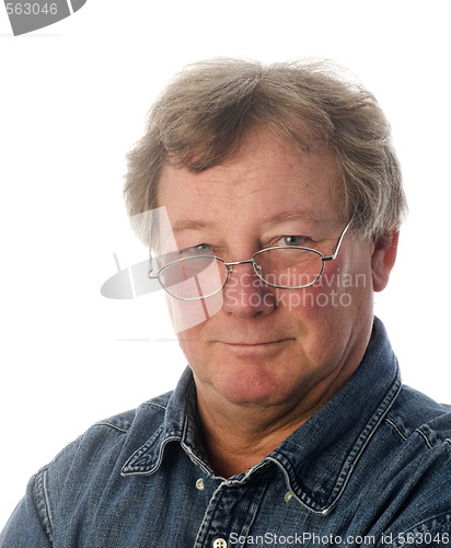 Image of smiling relaxed confident middle age senior man with eyeglasses 