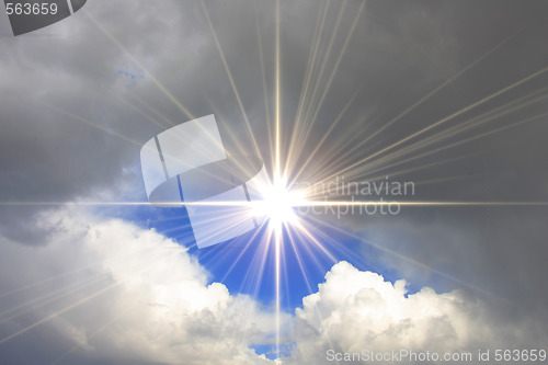 Image of blue sky with shining sun and clouds