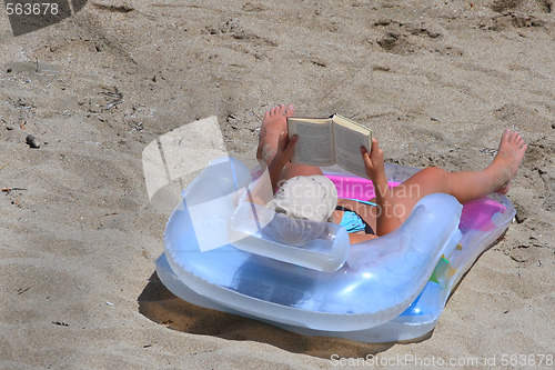 Image of reading on the  beach