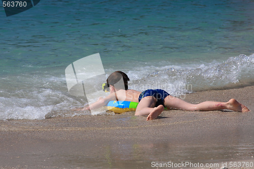 Image of Young boy in the sea