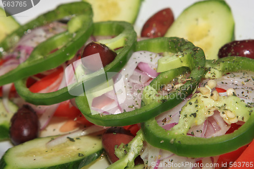 Image of greek salad with tomato, cheese and olives