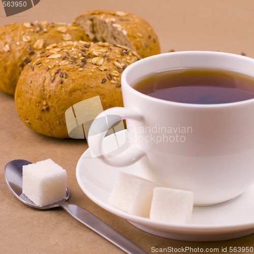 Image of cup of tea, sugar and bread