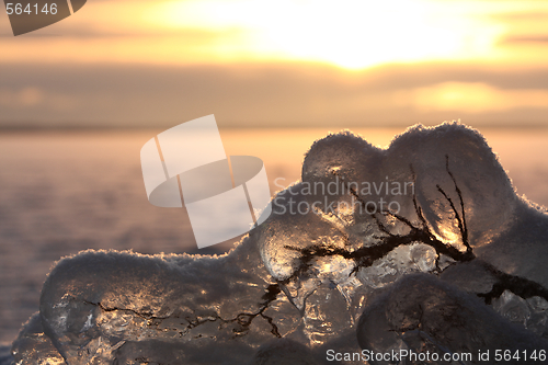 Image of Sunset over frozen lake