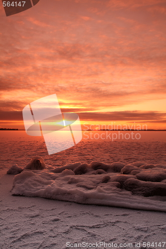 Image of Sunset over frozen lake