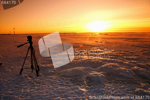 Image of Sunset over frozen lake