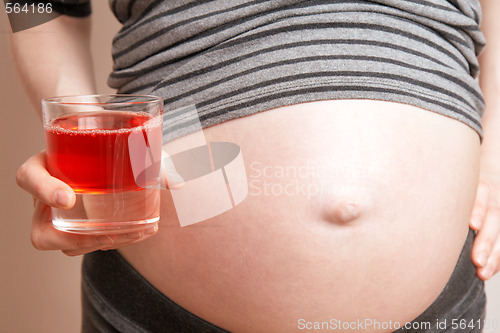 Image of pregnant woman with a juice