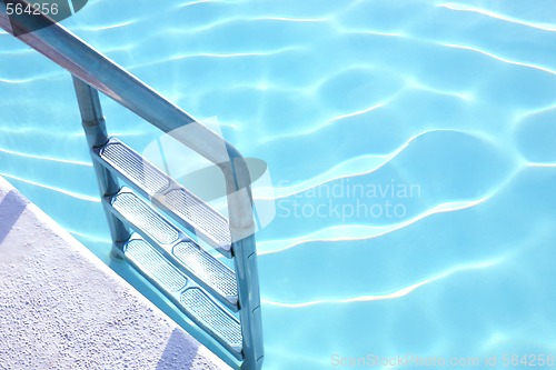 Image of Fragment of pool with a ladder and transparent water