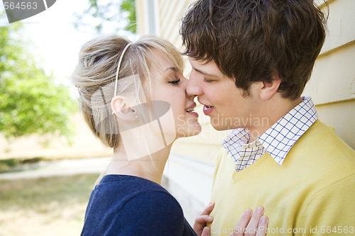 Image of Young caucasian couple kissing