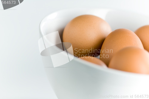 Image of Brown Eggs in White Bowl