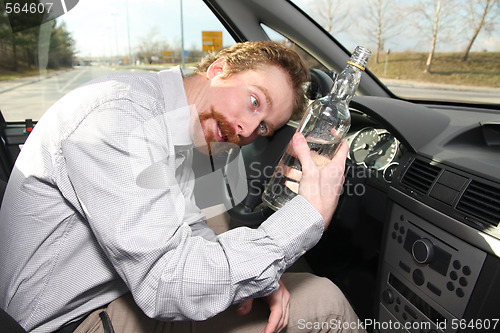 Image of Drunk man sitting in drivers