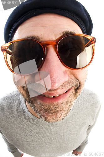 Image of aging artist thinking distorted nose close up beret hat